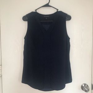 Blue and white polka dot sleeveless top